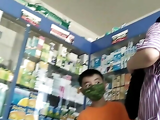 Mom with son in pharmacy. Little ass in red...